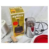 Various Kitchen Tools and Small Appliances including Zyliss Blitzhacker Food Chopper, Cuisinart Microwave Popcorn Maker, and Other Accessories
