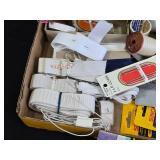 Box of Sewing Supplies including Threads, Bobbins, and Needles, Elastic Bands, and Lace Trim
