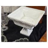 Various Decorative and Glass Items including Milk Glass Pedestal Bowl, Wooden Plaques, and Glassware