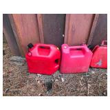 Lot of 6 Gas Cans - 4 Metal and 2 Plastic and the 2 of the tanks have fuel in them