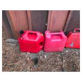 Lot of 6 Gas Cans - 4 Metal and 2 Plastic and the 2 of the tanks have fuel in them