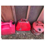 Lot of 6 Gas Cans - 4 Metal and 2 Plastic and the 2 of the tanks have fuel in them