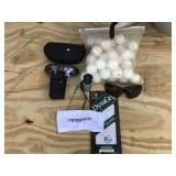 2 - 5 Gallon Pails of Golf Balls - Pair of Golf Gloves - 2 Pair of Sunglasses - Pat Golfer Wrist Counter, Range Finder and bag of whiffle balls
