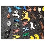 box of toy Indians, cowboys, horses, fence and animals