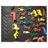 box of toy Indians, cowboys, horses, fence and animals