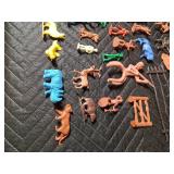 box of toy Indians, cowboys, horses, fence and animals
