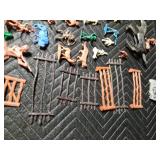 box of toy Indians, cowboys, horses, fence and animals