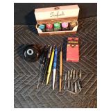 Vintage inkwell with extra pens and tips