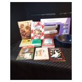 Lot of cookbooks, power control center, and enamelware colander,