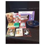 Lot of cookbooks, power control center, and enamelware colander,