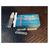 Vintage firestone Home and Auto first aid kit filled with misc. Hamms, Schmidt, Grainbelt bottle openers and more