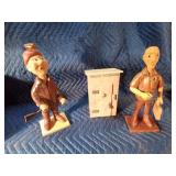 Wooden man. outhouse, and lady