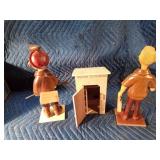 Wooden man. outhouse, and lady