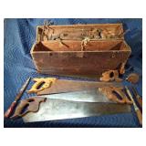 Vintage wood box with vintage tools: saws, files, hatchet head, chalk liner and more