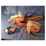 2 Homelite chainsaws and earmuffs