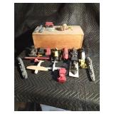 Wooden box of wooden vehicles: airplanes, trains, race cars and more