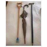 Canes and umbrella; black one with ...