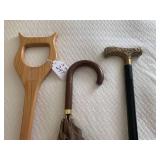 Canes and umbrella; black one with ...