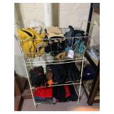 Small metal shelf with work gloves ...