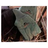 Small metal shelf with work gloves ...