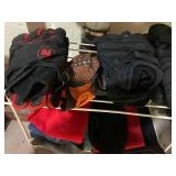 Small metal shelf with work gloves ...