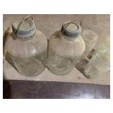 Vintage glass jars, saw and metal o...