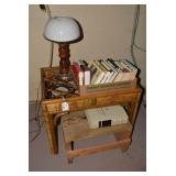 Wood bench, wicker table, books, la...
