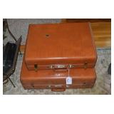 Sampson suitcases with military clo...