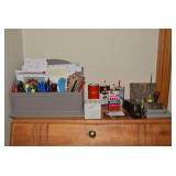 All items on top of desk - oil cans...