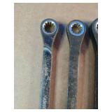 These are Husky ratcheting combination wrenches featuring a 12-point design for versatile use.