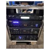 This is a professional karaoke equipment rack containing various audio components.