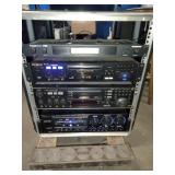 This is a professional karaoke equipment rack containing various audio components.