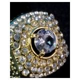 Brand New This is a men’s Pinky Ring yellow gold-plated ring featuring a large center stone surrounded by smaller simulated diamonds. Size 7