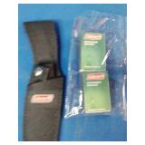 a Coleman 2000015157 fixed-blade knife with a stainless steel blade and wood handle