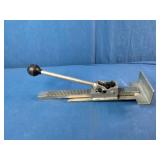 This is a Powernail PowerJack Model 100 flooring jack used to position and straighten hardwood floor boards.