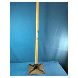 This is a True Temper 8 inch by 8 inch steel head tamper with wood handle