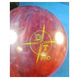 This is a 15 pound Dyno-Thane The Thing Returns bowling ball featuring a red and maroon swirl pattern