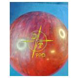 This is a 15 pound Dyno-Thane The Thing Returns bowling ball featuring a red and maroon swirl pattern