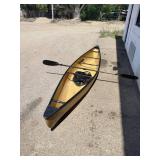 Wenonah Wee Lassie solo canoe featuring a lightweight hull and a kayak-style paddle.