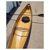 Wenonah Wee Lassie solo canoe featuring a lightweight hull and a kayak-style paddle.