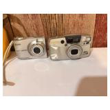 Pentax IQZoom 130M 35mm point-and-shoot film camera &Kodak EasyShare digital camera, likely the C913 model