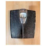 1950 Detecto bathroom scale featuring a speckled black finish and a bubble glass dial