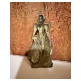 vintage pewter or bronze statue of a woman riding a bicycle