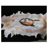 HAND-PAINTED ART ON ANIMAL HIDE