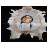 HAND-PAINTED ART ON ANIMAL HIDE
