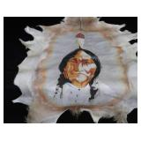 HAND-PAINTED ART ON ANIMAL HIDE
