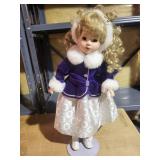 Collectible Blonde Doll in Formal Winter Outfit