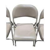 4 Uline H-2522 Padded Folding Chairs - Tan Vinyl Seat and Back