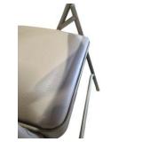 4 Uline H-2522 Padded Folding Chairs - Tan Vinyl Seat and Back