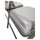4 Uline H-2522 Padded Folding Chairs - Tan Vinyl Seat and Back